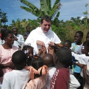 Fr._Patrick Baikauskas, O.P., Pastor, Director of Campus Ministry, Purdue University_with Haitian Children on mission trip with Purdue students